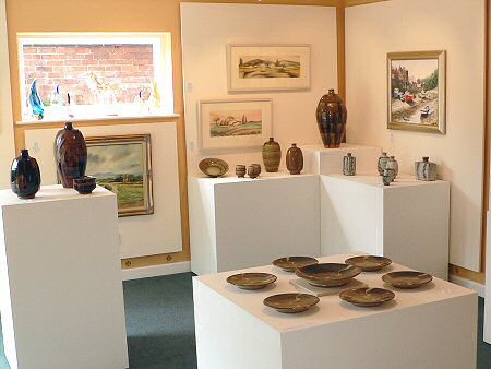 Pots and pictures in the coachhouse gallery
