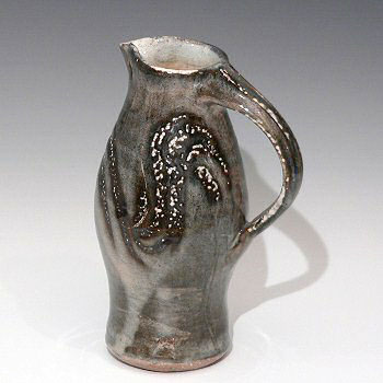 Soda glaxed stoneware jug with finger wipe decoration