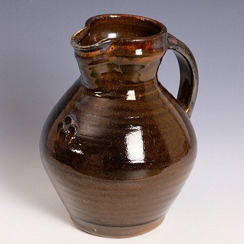 Leach Pottery early treacle glaze jug by Michael Cardew