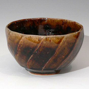 Spirally facetted stoneware tea bowl.