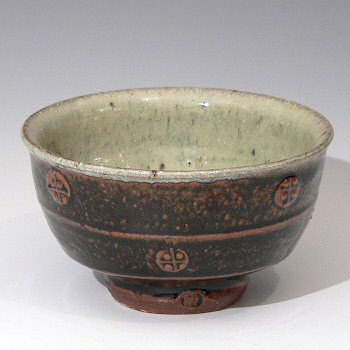 Small decorated bowl, ash glazed interior, tenmoku exterior.