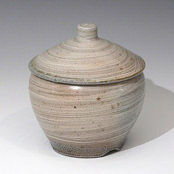 Stoneware lidded jar with swirled glaze decoration