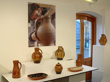 Image of Doug potting with exhibition pots