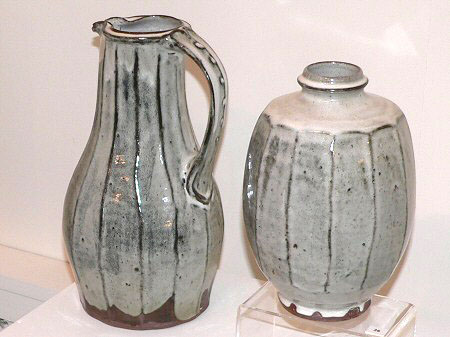 Tall cut sided jug, cut sided bottle vase, both nuka glazed over dark slip