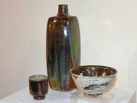 Tall bottle with copper pours, hakeme glazed bowl with fish decoration, yunomi with finger wipe decoration