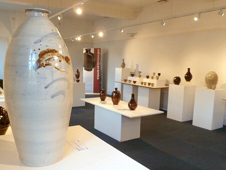 Tall porcelain bottle with fish decoration