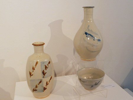Tall bottle with fish decoration, squared bottle and bowl, all porcelain
