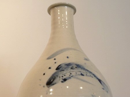 Fish decoration on a tall porcelain bottle