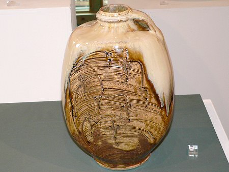 Footed bottle with handle - engraved decoration