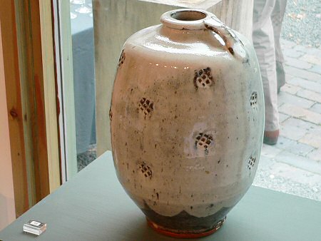 Footed bottle with handle - repeat indent decoration