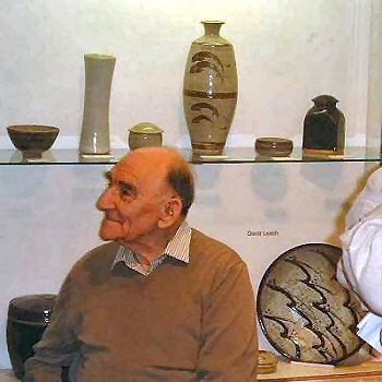 David Leach listening to Henry Sandon's opening remarks. In the background is a case with pots by Bernard and David Leach - loaned from private collections