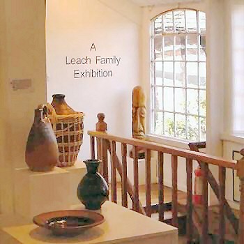 John Leach pots and a wood carving by Ben Leach