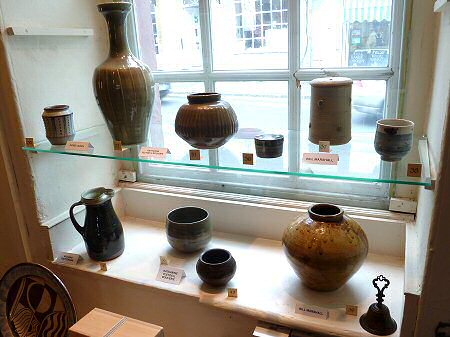 Two David Leach pots, Katherine Pleydell-Bouverie, three Bill Marshall pots. Bottom row - Richard Batterham, two Katherine Pleydell-Bouverie pots, Bill Marshall