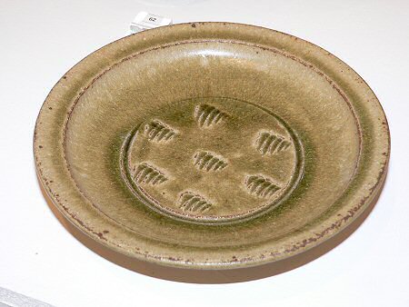 Ash glazed plate with incised decoration