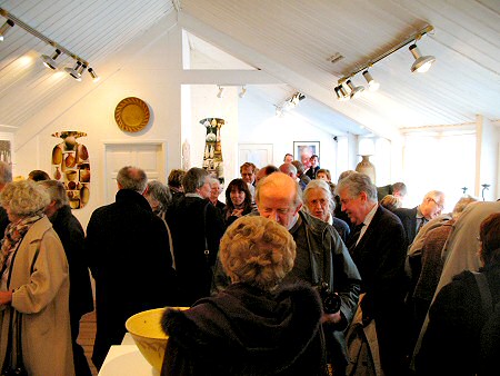 The Gallery Upstairs filled with people
