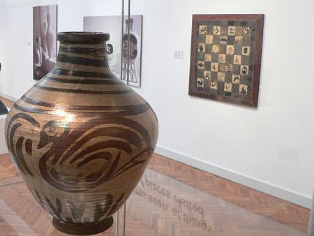 William Staite-Murray pot with Bernard Leach tiled plaque beyond