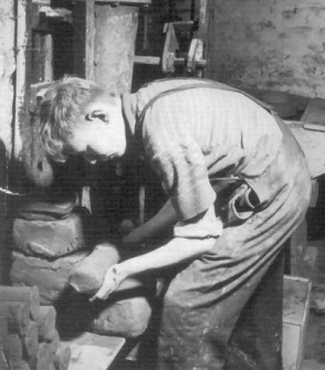 Don Jones pugging clay at Winchcombe Pottery in 1950