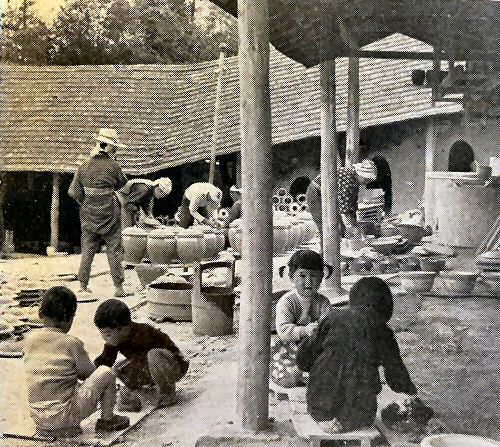 Traditional pottery glazing and kiln stacking