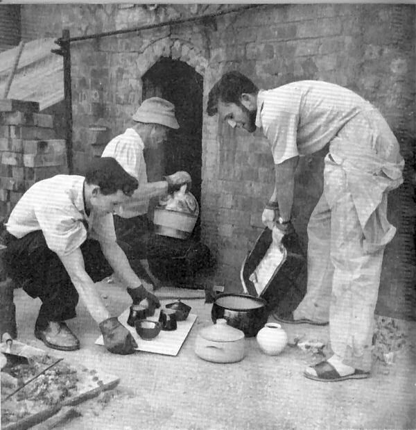 Unpacking the kiln at Avoncroft Pottery in 1958.