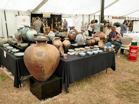 Svend Bayer at work beside his stand