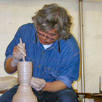 Ken Matsuzaki working on a sake bottle