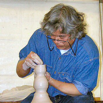 Ken Matsuzaki forming a sake bottle