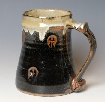 Stoneware tankard, nuka over temmoku with crucifix stanped pattern.