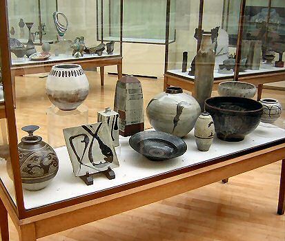 The Masterpieces Case - Left to right - Bernard Leach, Hans Coper, Shoji Hamada, Shoji Hamada, Lucie Rie, Lucie Rie, Janet Leach, Bernard Leach, Michael Cardew, William Staite-Murray, Hans Coper, Norah Braden