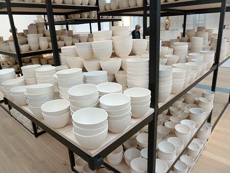 Through the Claire Twomey 10,000 bowl installation