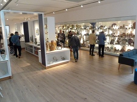 Entrance to the Anthony Shaw exhibition and the wall of pots