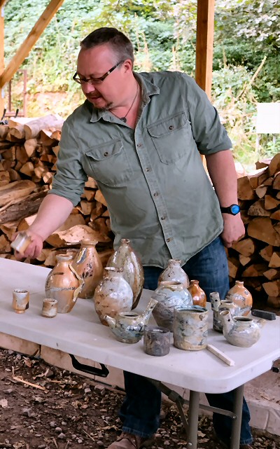 Richard with some pots fresh from the wood kiln