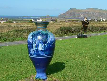 Huge vase on the lawn in from of the pottery