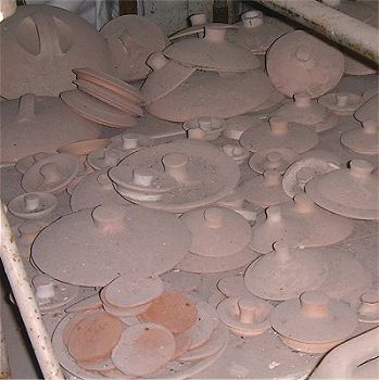 Pile of potlids gathering dust