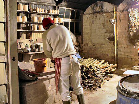 Jeremy Leach mixing clammings to seal the kiln