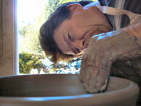 Close up of Simon Leach throwing a bowl