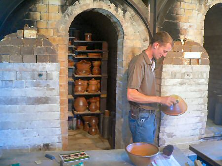 Pots from the first chamber being fettled