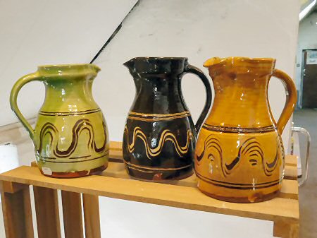 Slipware pots for sale in the showroom